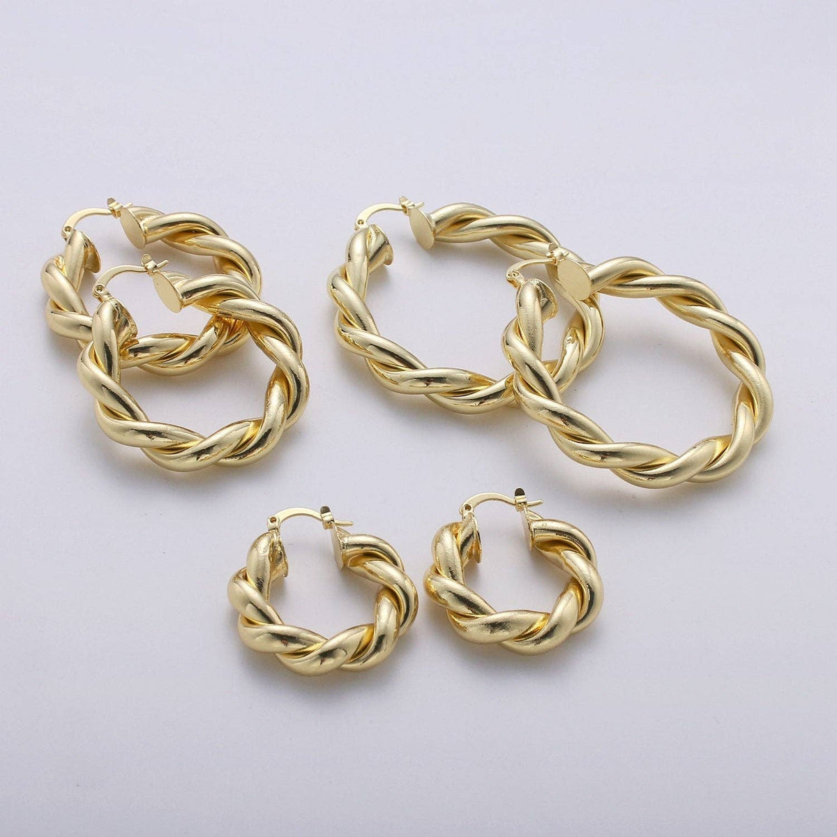 $245 | Gold Twisted Hoop Earrings