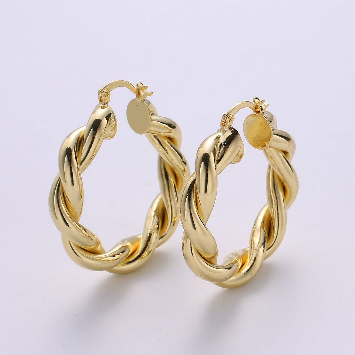 $245 | Gold Twisted Hoop Earrings
