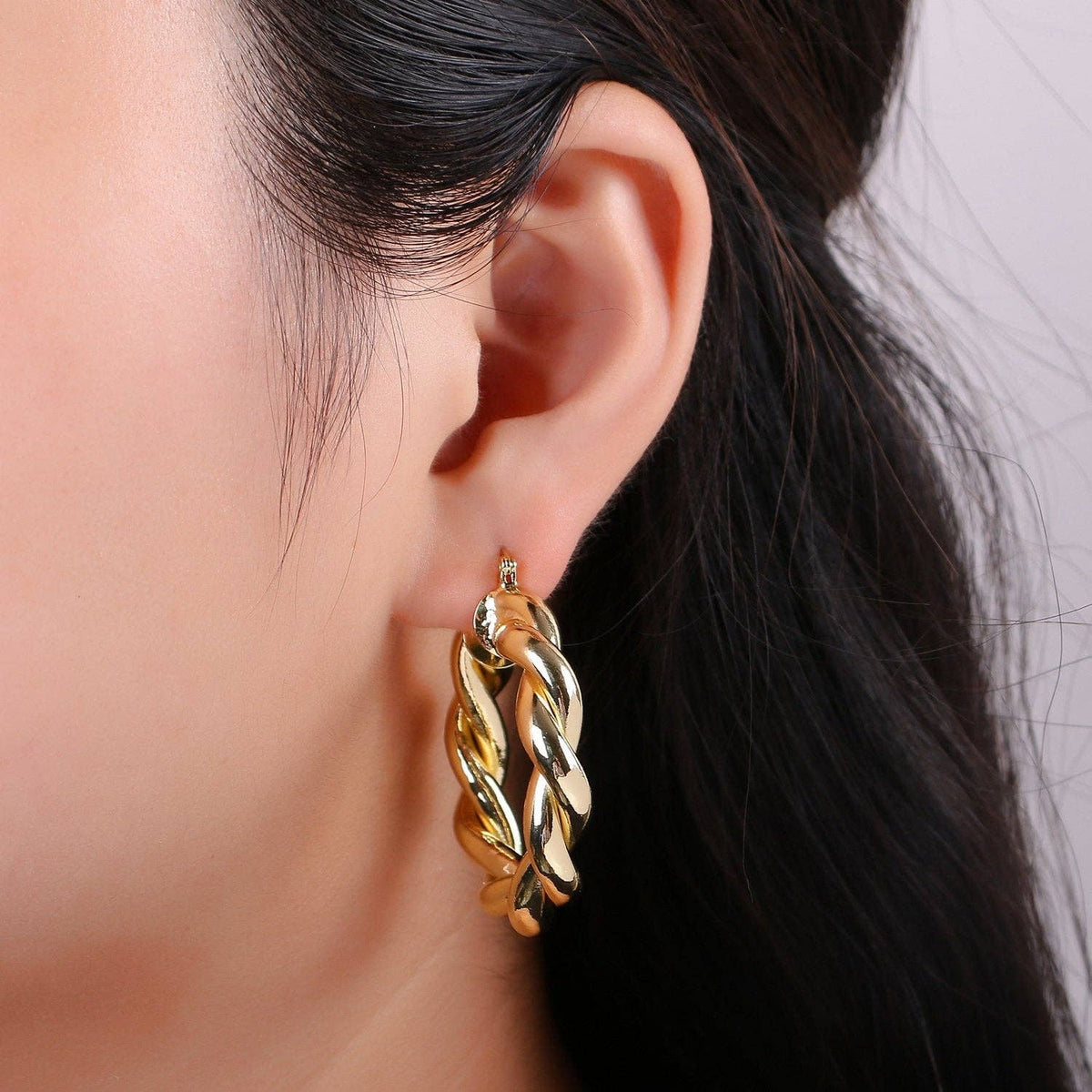 $245 | Gold Twisted Hoop Earrings