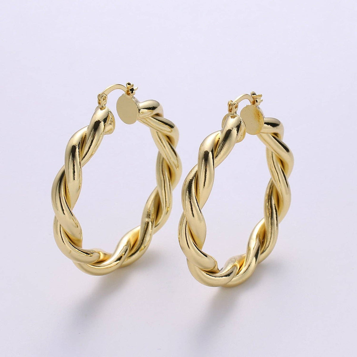 $245 | Gold Twisted Hoop Earrings