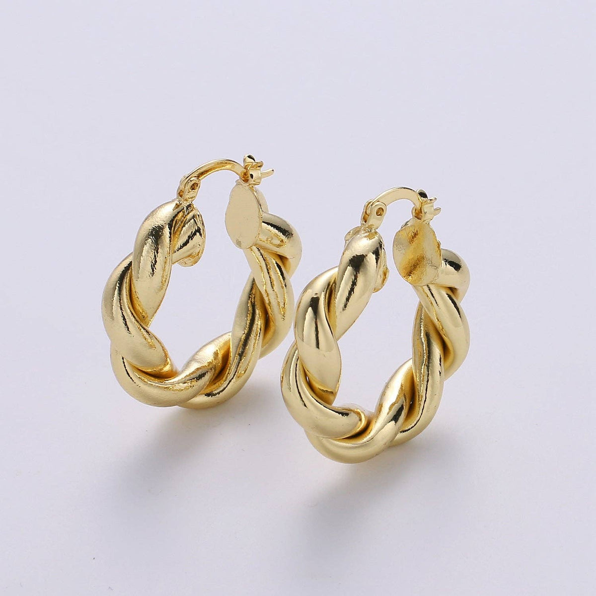 $245 | Gold Twisted Hoop Earrings