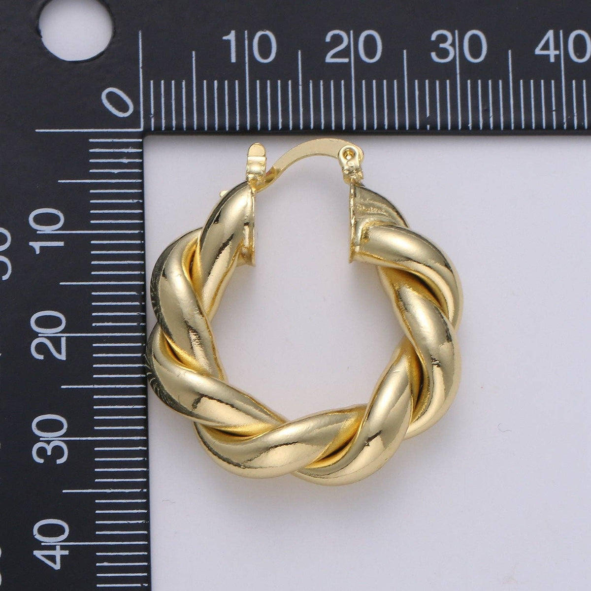 $245 | Gold Twisted Hoop Earrings